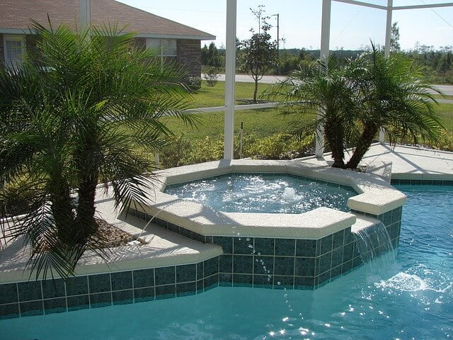 Outdoor hot tub and pool in use after waterproofing