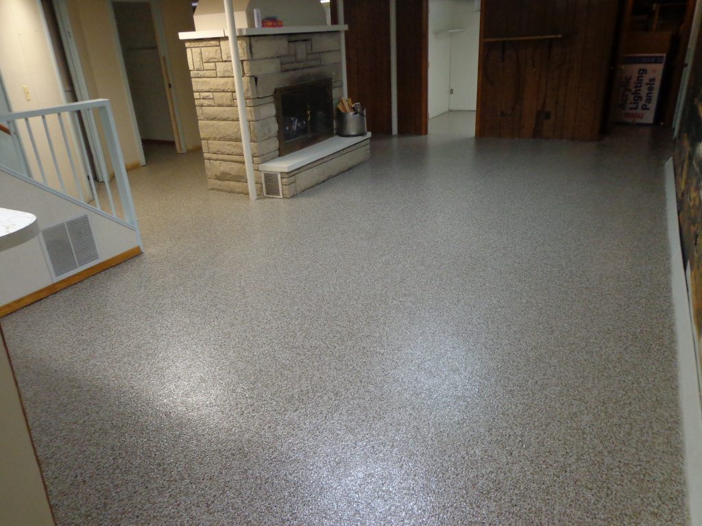 Basement after waterproofing and GraniFlex floor system has been applied