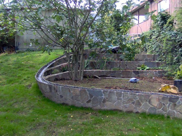 Garden and landscaping wall with bushes and trees